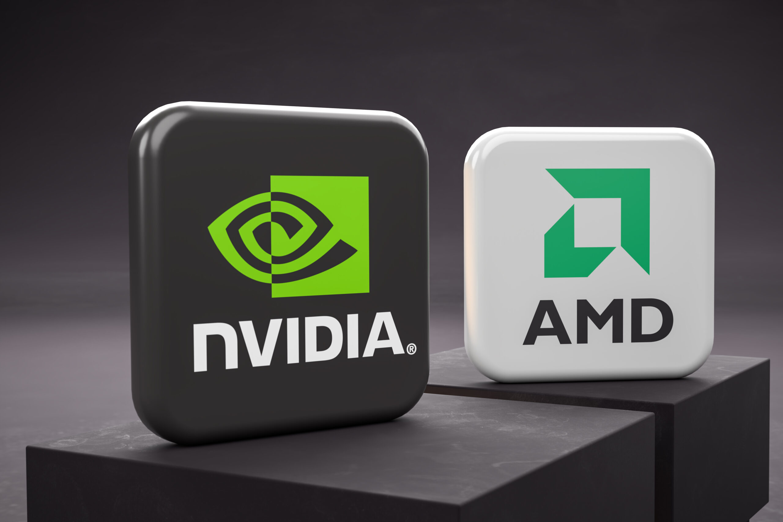 Logos of the competing tech companies designing graphics card chips nvidia and AMD on two pedestals.