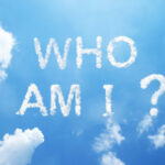 "who am I?" cloud word on sky.