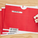 Red mailing envelopes with popcorn