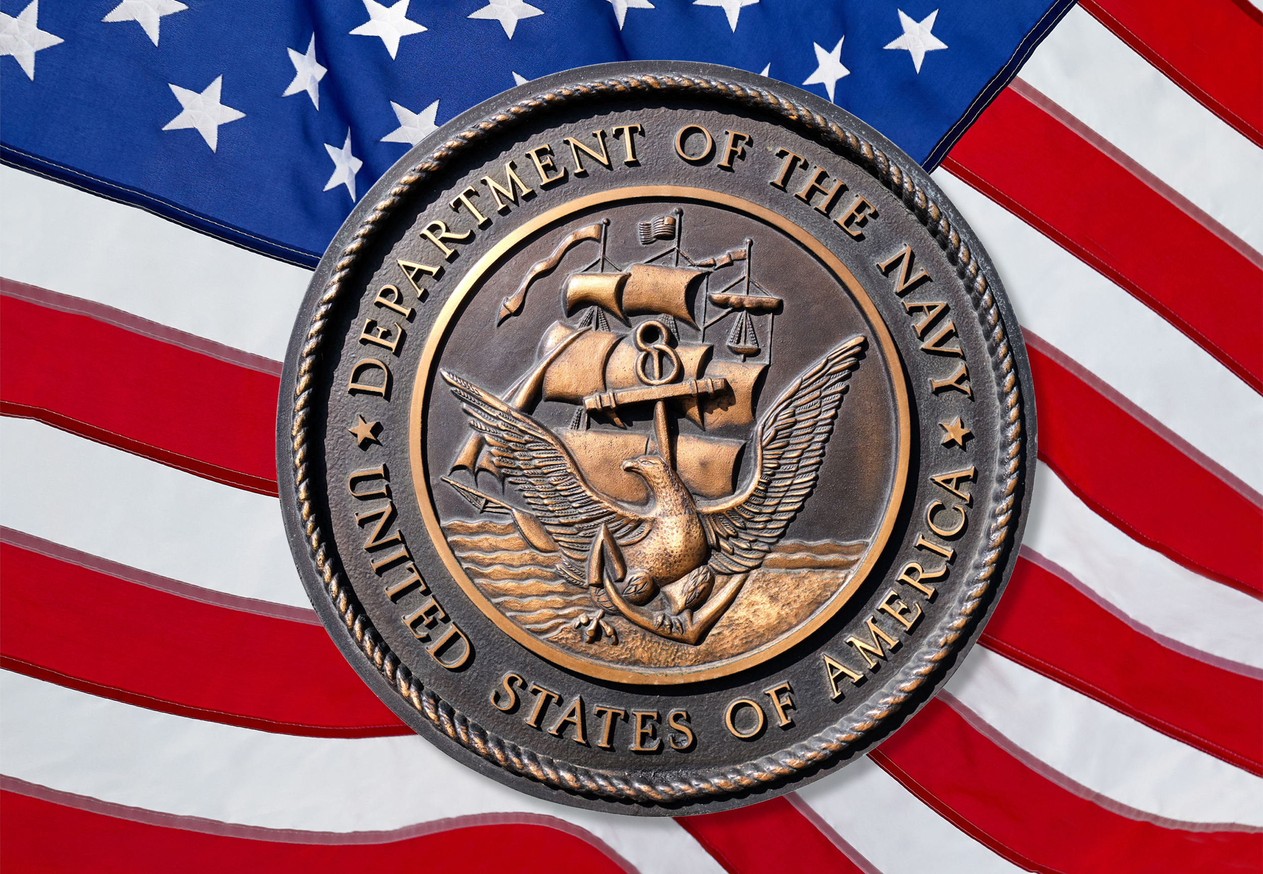 Los Angeles, California  USA - March 12 2019: U.S. Navy logo or emblem  on American Flag background