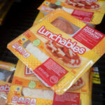 West Linn, OR, USA - Sep 7, 2021: Lunchables Pizza with Pepperoni is seen in the cooler at a Walmart neighborhood market. Lunchables is a brand of food and snacks manufactured by Kraft Heinz.