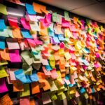 A whiteboard in an office setting is filled with numerous vibrant, multi-colored sticky notes, creating a visually dynamic and organized display of important informa. Generated with AI.