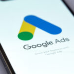 Google Ads logo mobile app on a screen smartphone iPhone closeup. Ads is a service of contextual, basically, search advertising from Google. Batumi, Georgia - October 5, 2023