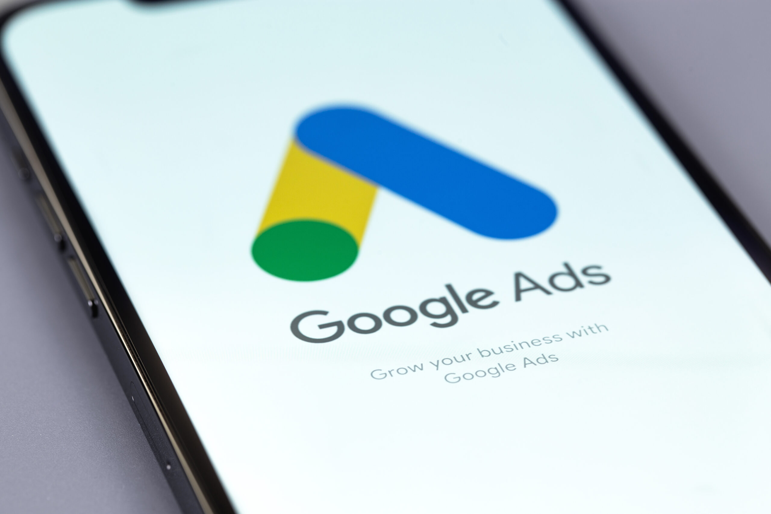 Google Ads logo mobile app on a screen smartphone iPhone closeup. Ads is a service of contextual, basically, search advertising from Google. Batumi, Georgia - October 5, 2023