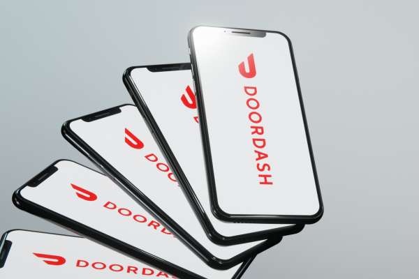 DoorDash logo displayed on smartphones.