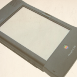 The image shows an Apple Newton MessagePad 2100, a handheld personal digital assistant (PDA) designed and marketed by Apple Computer in the late 1990s.