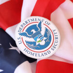 US Department of Homeland Security seal on United States of America flag close u