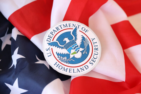 US Department of Homeland Security seal on United States of America flag close u