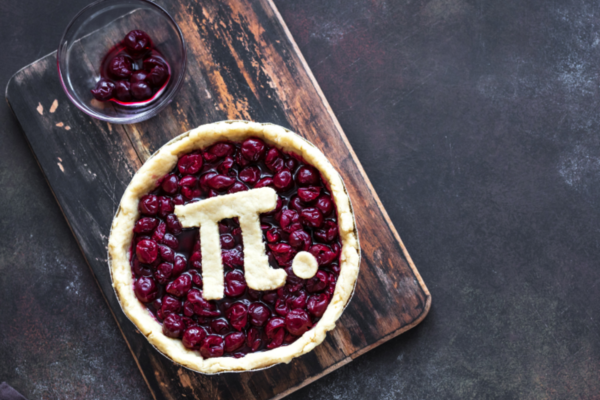 An image of a pie with a crust on the top shaped as the mathematical symbol "pi"