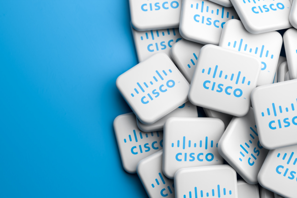 A pile of white key-shaped promotional items with the Cisco logo on a blue background.
