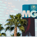 A composite image juxtaposing the facade of the MGM Resorts International building with a background of a computer screen displaying code.