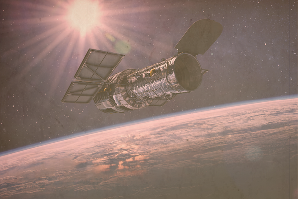 Image of the Hubble Space Telescope floating in space.
