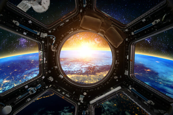 Earth and Spacecraft. Elements of this image furnished by NASA.