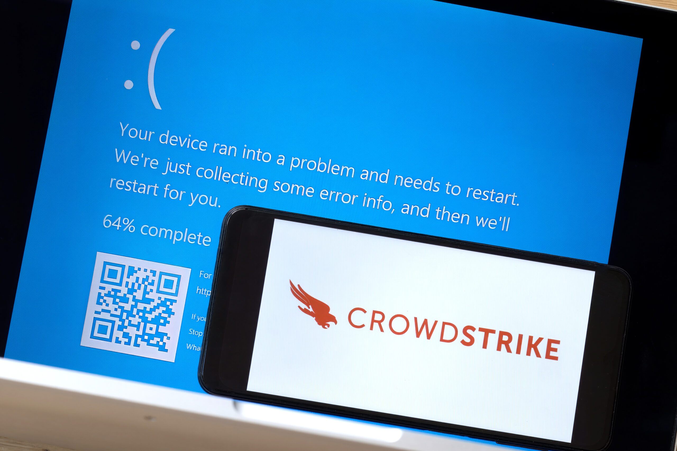 The CrowdStrike logo and a blue computer screen appeared during mass tech outages worldwide, causing IT systems to shut down.
Robert - stock.adobe.com