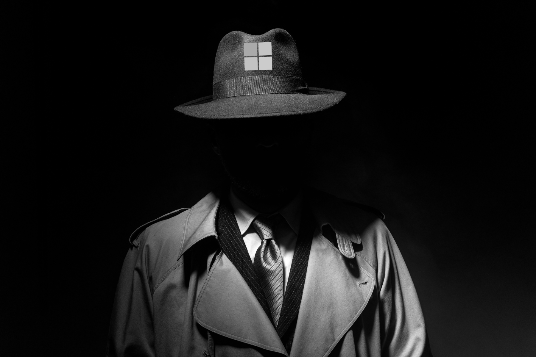 Noir movie character with Microsoft logo displayed on hat.
