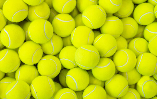Lots of vibrant tennis balls, pattern of new tennis balls for background