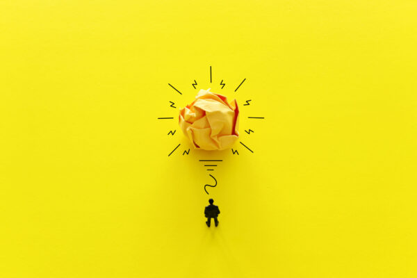 Crumpled paper as light bulb, metaphor for a successful mindset.