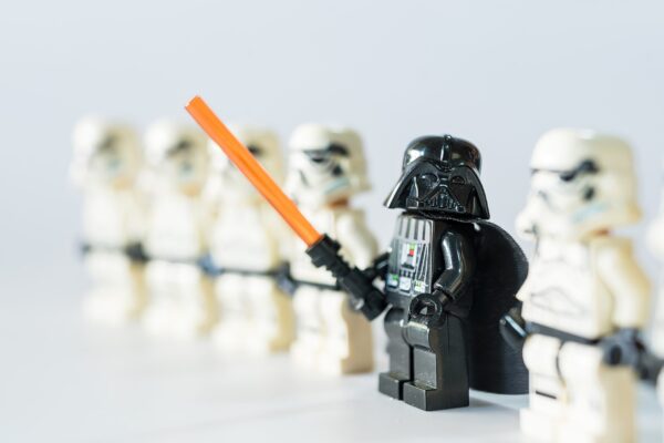 Lego darth vader standing in a row of Lego strom trooper Star Wars