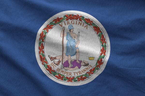 Virginia US state flag depicted on folded wavy fabric of old cloth