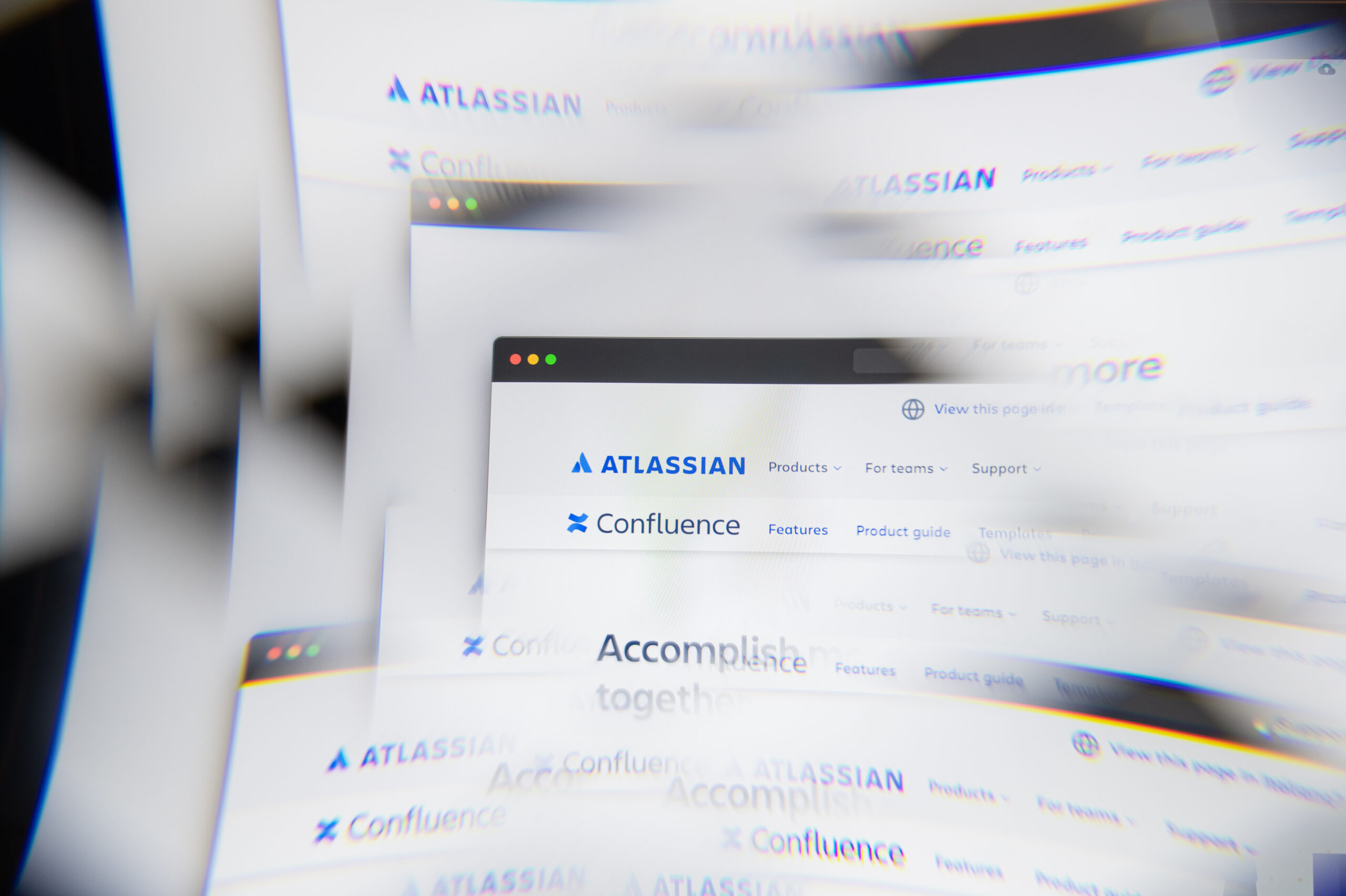 Milan, Italy - APRIL 10, 2021: Atlassian Corporation Plc logo on laptop screen seen through an optical prism. Dynamic and unique image from Atlassian Corporation Plc website. Illustrative editorial.