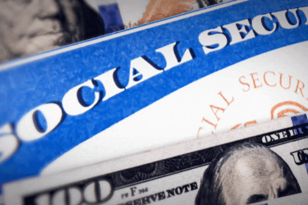 Social Security card with USD currency bill, 4k footage. 100-dollar bill and social security benefit card background. USA people, rights, financial support, political.
