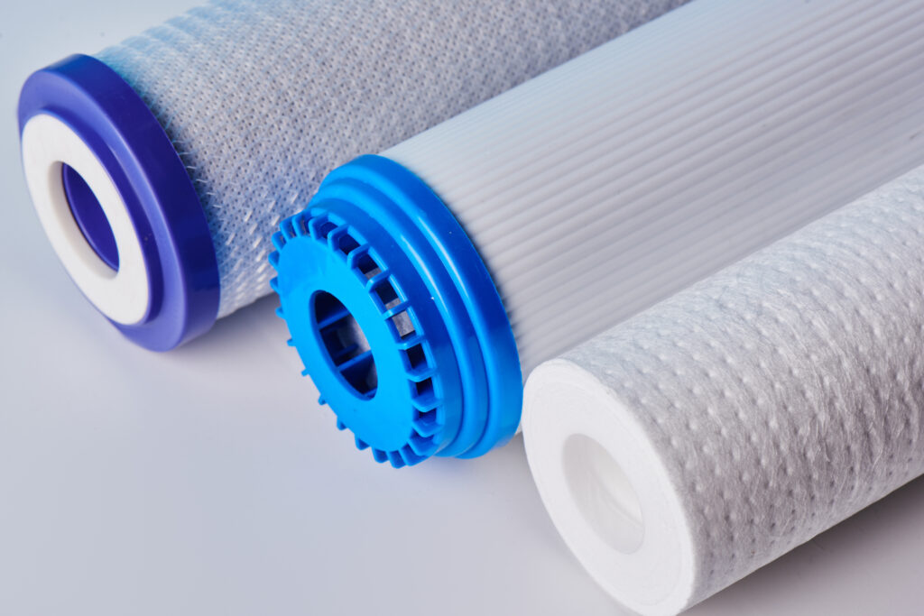 Water filters. Carbon cartridges on a white background. Household filtration system.