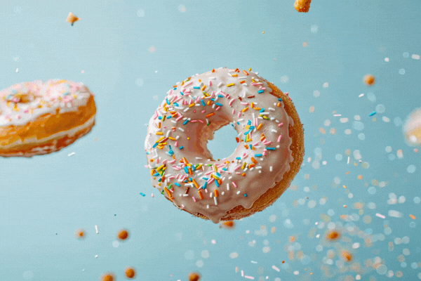 donuts falling on a light background. Selective focus