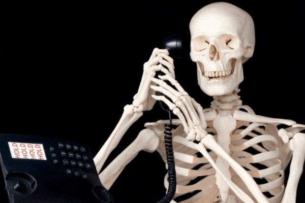 Skeleton answering phone