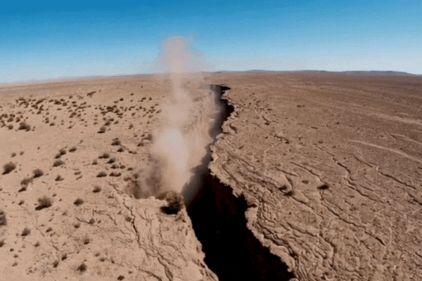 A deep fault line across a vast desert landscape