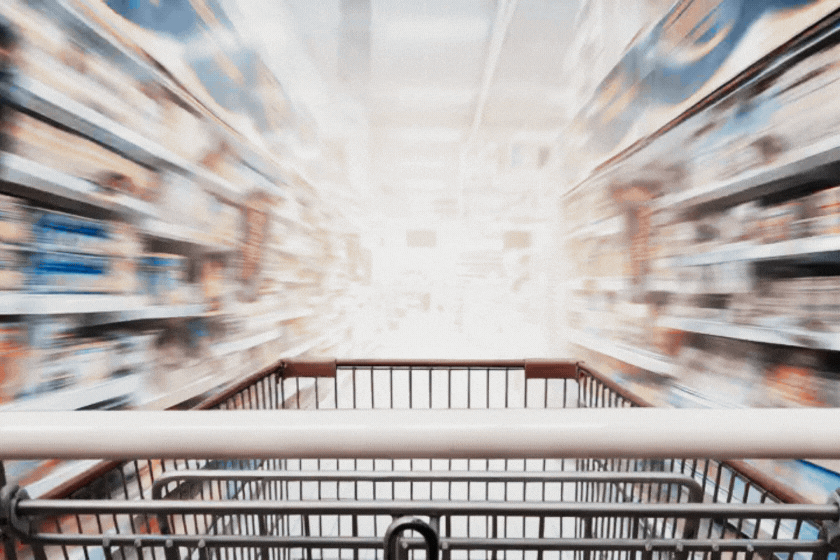 shopping cart going through the supermarket aisle