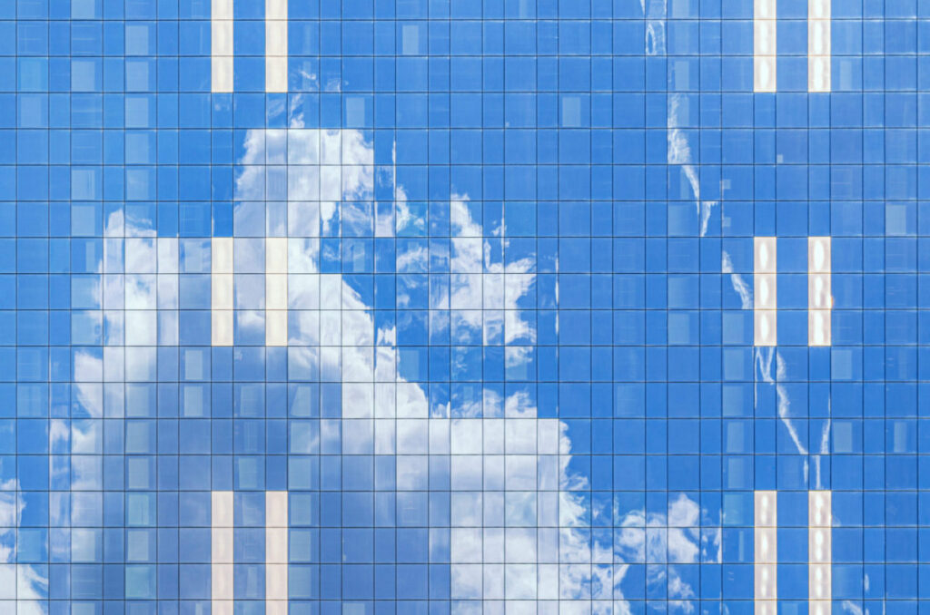 South Tower skyscraper modernism architecture style, modern high-rise office building, abstract details of facade glass curtain wall cells reflecting white clouds in blue sky, Brussels city, Belgium