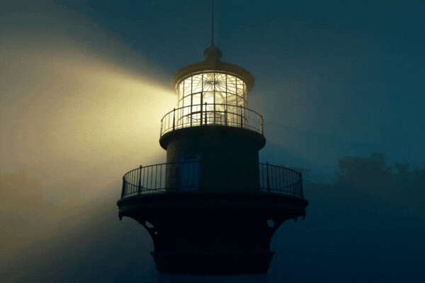 Lighthouse light spinning around. Tall tower standing on the coastline.