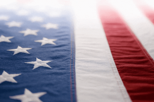 Slow motion of a US American flag. Background for Memorial Day, Veteran's Day, 4th of July, or other patriotic USA holiday.