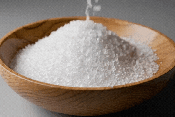 Table salt in a wooden bowl