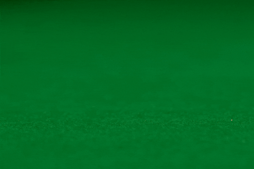 Red dice rolling on casino table