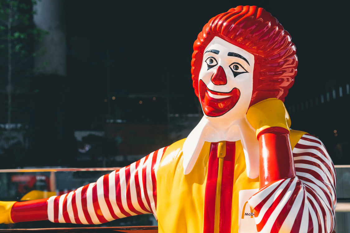 Mc Donald Mascot relax on bench Brand Figure shop outdoor BANGKOK, THAILAND - 10 OCT, 2019