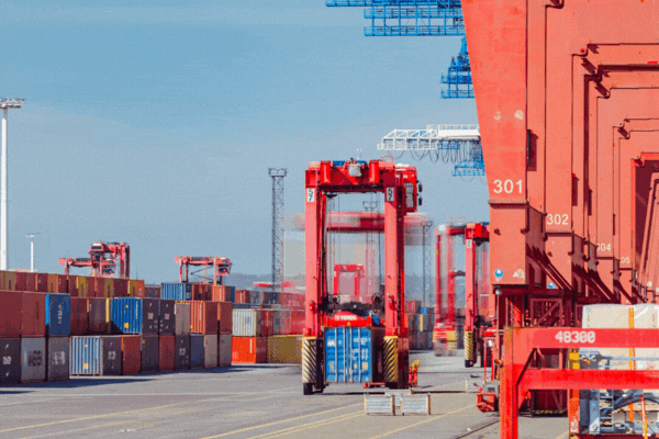 Container ship loading and unloading in deep sea port, import and export freight transportation by container ship