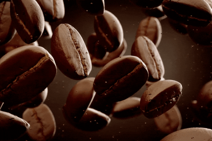 Slow motion animation of aromatic dark coffee beans falling down.