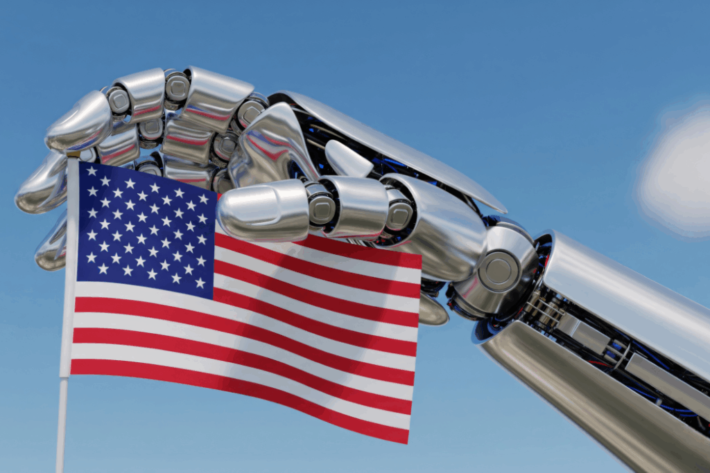 Robotic Hand Holding American Flag Against Blue Sky
