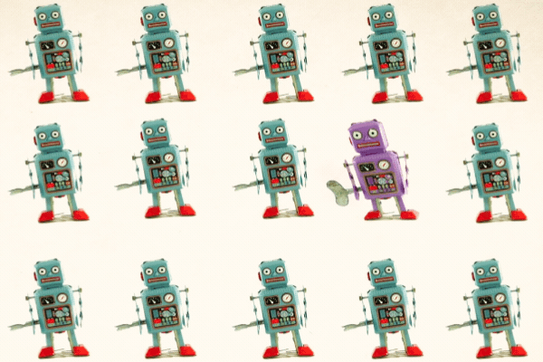 concept stand out from the crowd with lots of retro robots and one unique one