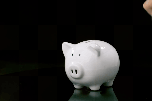 Slow motion shot of a Piggy Bank being smashed open
