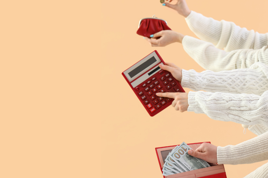 Women with money, wallets and calculator on beige background