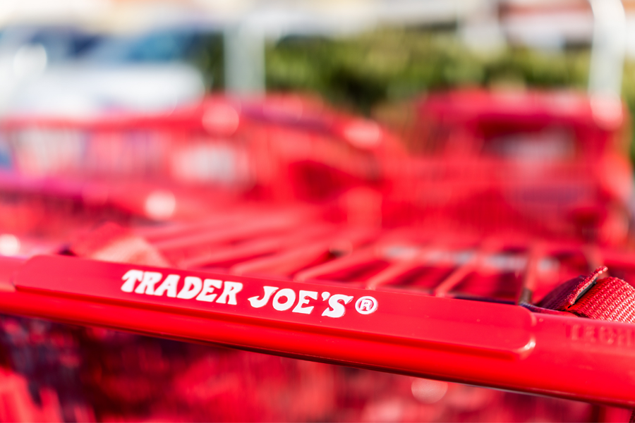 Red shopping carts with Trader Joes grocery store sign on handle