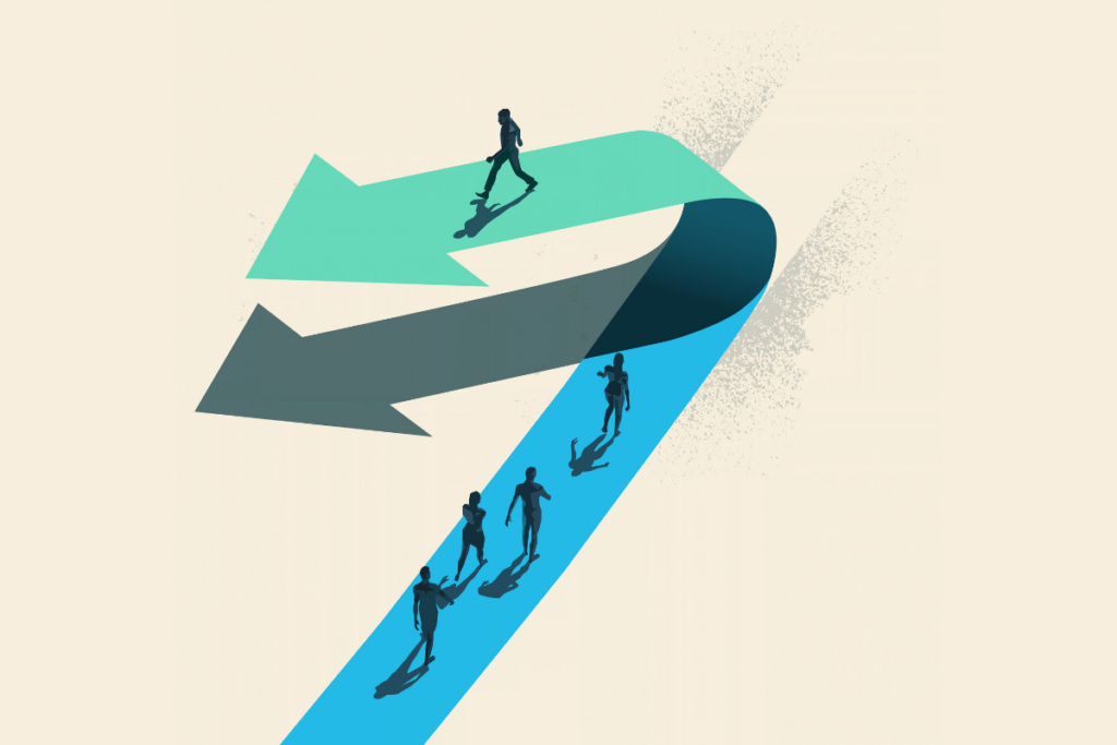 A businessman choosing to walk in the opposite direction to other people on top of a arrow.