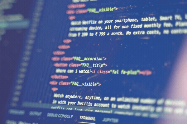 Code for a website is scrolled upward in an IDE as a programmer finds the line to insert lines to debug a recent change in a security model